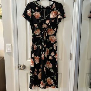 Lulu’s Aliso medium black floral print midi dress with cut outs.